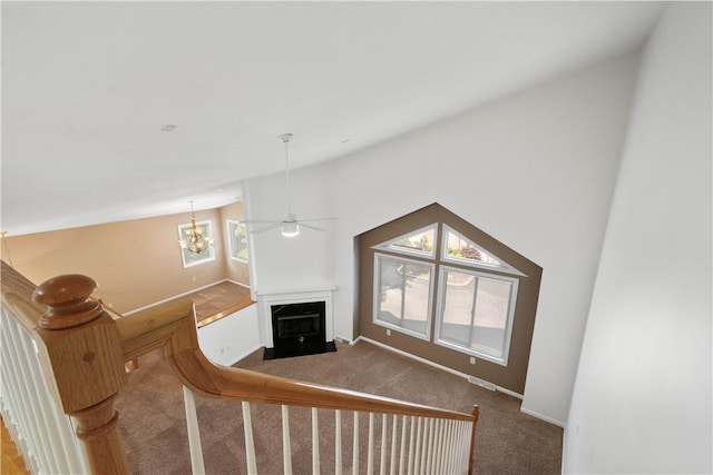 9404 Sundance Dr, South Fayette, PA 15017 - carpeted living room with a fireplace with flush hearth, vaulted ceiling, and a chandelier