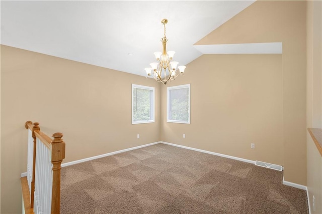 9404 Sundance Dr, South Fayette, PA 15017 - spare room with a chandelier, carpet flooring, and lofted ceiling