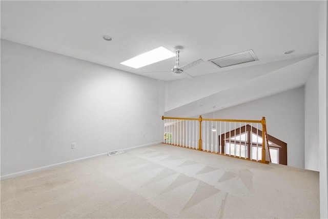 9404 Sundance Dr, South Fayette, PA 15017 - empty room featuring carpet floors, lofted ceiling, and a skylight