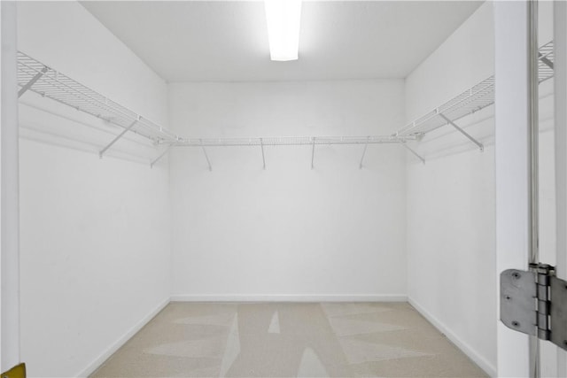 9404 Sundance Dr, South Fayette, PA 15017 - walk in closet featuring light carpet