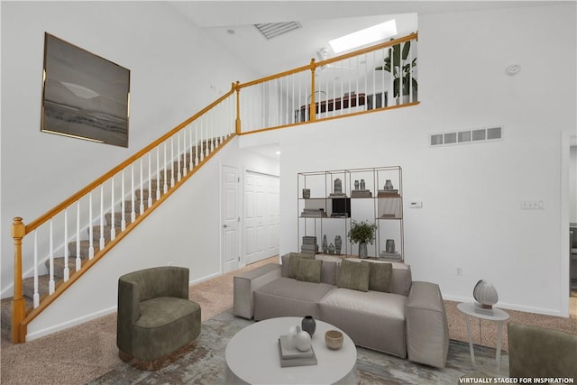 9404 Sundance Dr, South Fayette, PA 15017 - carpeted living room with a towering ceiling and stairway