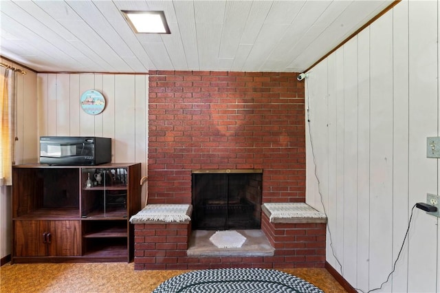 890 Deer Ln, Rochester Twp, PA 15074 - living room featuring a brick fireplace and wooden walls