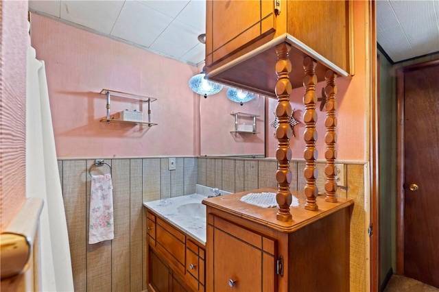 890 Deer Ln, Rochester Twp, PA 15074 - bathroom with vanity, wainscoting, and tile walls