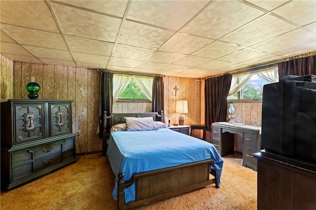890 Deer Ln, Rochester Twp, PA 15074 - bedroom featuring light colored carpet, multiple windows, wood walls, and freestanding refrigerator