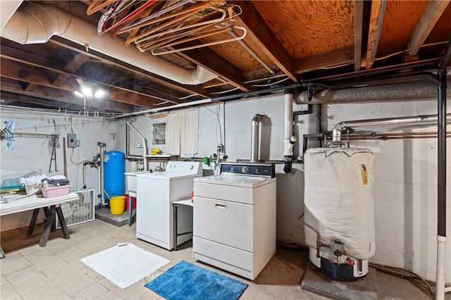 890 Deer Ln, Rochester Twp, PA 15074 - unfinished basement featuring water heater, washing machine and dryer, and a water pressure tank