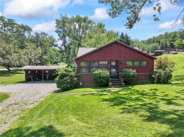 890 Deer Ln, Rochester Twp, PA 15074 - view of front facade with driveway, a carport, a front yard, and brick siding