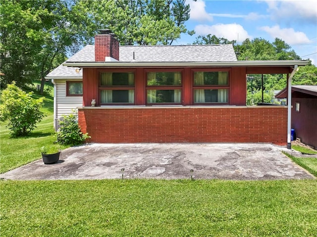 890 Deer Ln, Rochester Twp, PA 15074 - rear view of house with a yard, a patio area, a chimney, and roof with shingles