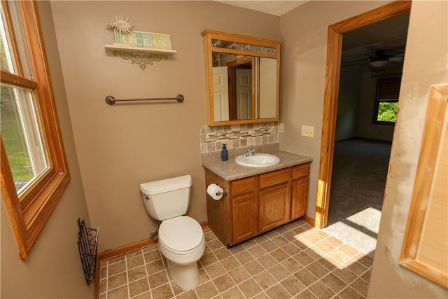 158 Snowdrift Rd, Nottingham, PA 15330 - half bathroom with vanity, plenty of natural light, tasteful backsplash, and tile patterned floors