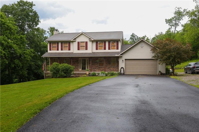 158 Snowdrift Rd, Nottingham, PA 15330 - view of front of home featuring asphalt driveway, an attached garage, a chimney, a front yard, and covered porch