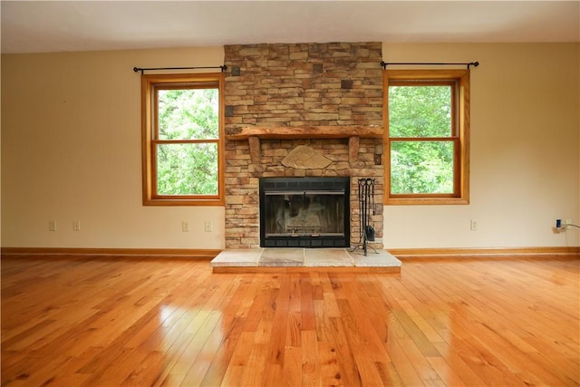 158 Snowdrift Rd, Nottingham, PA 15330 - unfurnished living room with wood-type flooring and a stone fireplace