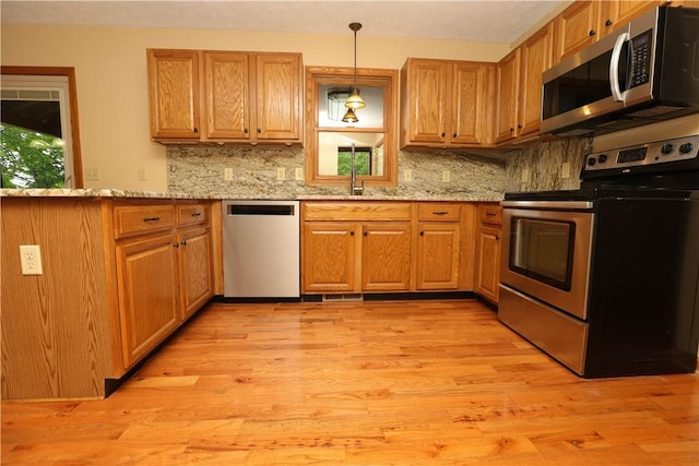158 Snowdrift Rd, Nottingham, PA 15330 - kitchen featuring appliances with stainless steel finishes, backsplash, and light wood finished floors