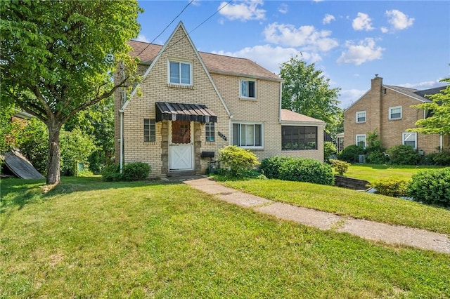 1324 Maple Ave, Verona, PA 15147 - view of front facade with a front yard and brick siding