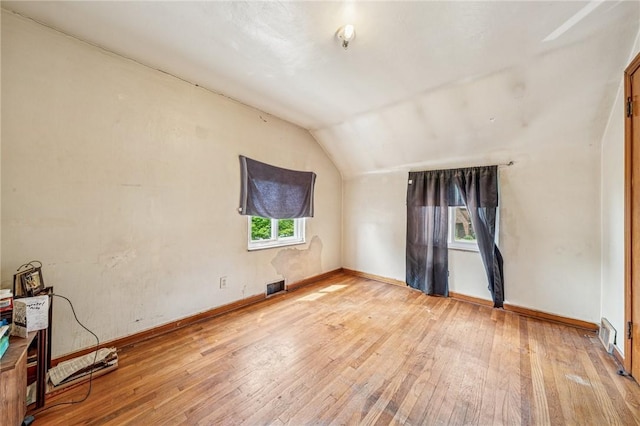 1324 Maple Ave, Verona, PA 15147 - unfurnished room featuring light wood-style floors, lofted ceiling, healthy amount of natural light, and a pendent fire sprinkler