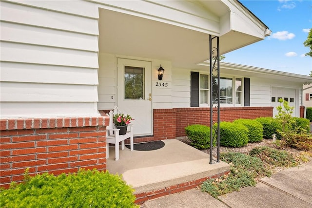 2345 Stoystown Rd, Somerset Twp, PA 15541 - entrance to property with a porch, brick siding, and an attached garage