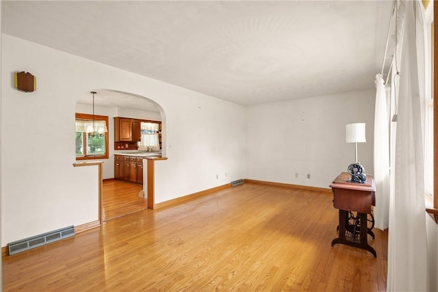 2345 Stoystown Rd, Somerset Twp, PA 15541 - spare room with arched walkways and light wood-style flooring