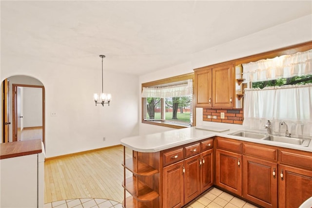 2345 Stoystown Rd, Somerset Twp, PA 15541 - kitchen with open shelves, light countertops, a peninsula, and arched walkways
