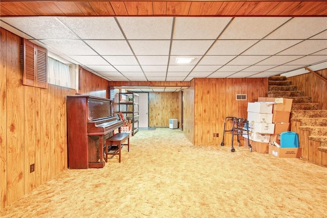 2345 Stoystown Rd, Somerset Twp, PA 15541 - sitting room featuring wooden walls, carpet, stairway, and a paneled ceiling