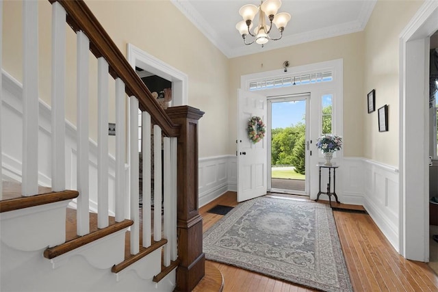 899 Old Thorn Run Rd, Moon/Crescent Twp, PA 15108 - foyer with stairway, a chandelier, a decorative wall, hardwood / wood-style flooring, and a wainscoted wall