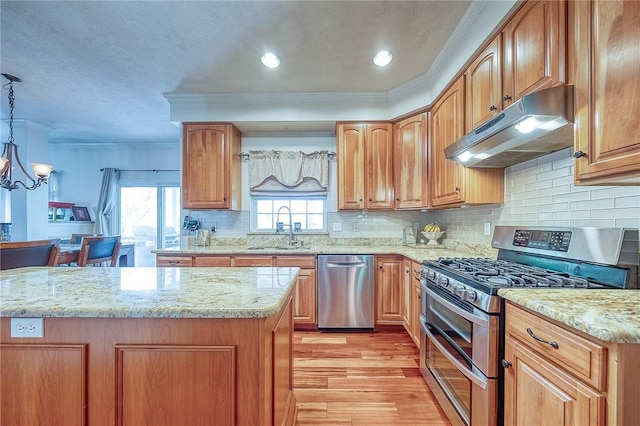 400 Chapel, Cranberry Twp, PA 16066 - kitchen with appliances with stainless steel finishes, under cabinet range hood, crown molding, light wood-style floors, and light stone countertops