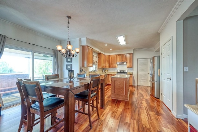 400 Chapel, Cranberry Twp, PA 16066 - dining space featuring light wood-style floors, a chandelier, ornamental molding, and recessed lighting