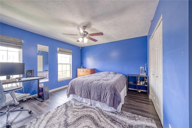 400 Chapel, Cranberry Twp, PA 16066 - bedroom with wood finished floors, a textured ceiling, an office area, ceiling fan, and a closet