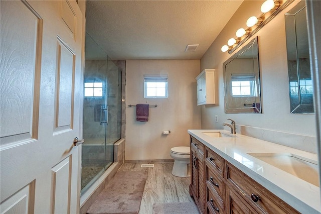 400 Chapel, Cranberry Twp, PA 16066 - bathroom featuring double vanity, a shower stall, and a textured ceiling