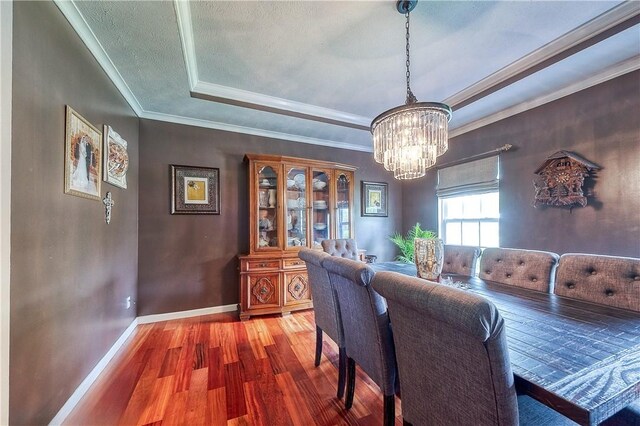 400 Chapel, Cranberry Twp, PA 16066 - dining room featuring wood finished floors, a chandelier, a raised ceiling, and ornamental molding
