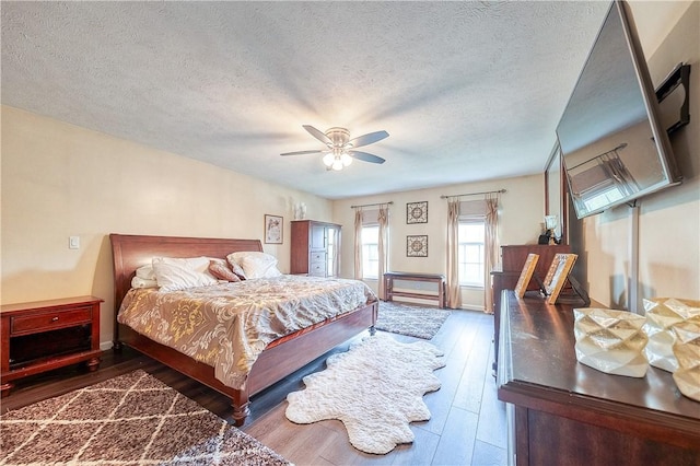 400 Chapel, Cranberry Twp, PA 16066 - bedroom with a textured ceiling, wood finished floors, and a ceiling fan
