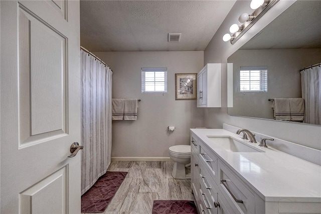 400 Chapel, Cranberry Twp, PA 16066 - full bathroom with healthy amount of natural light, vanity, a textured ceiling, and curtained shower