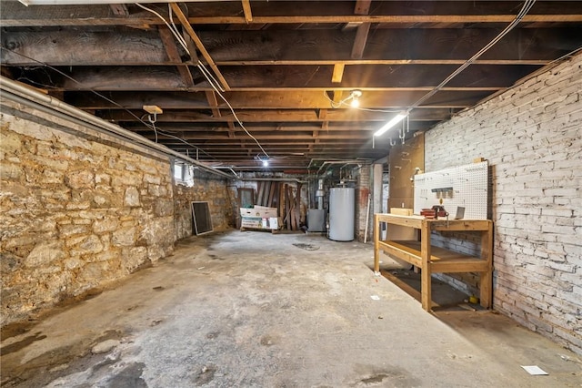 520 Morrell Ave, Connellsville, PA 15425 - unfinished basement featuring gas water heater and a workshop area