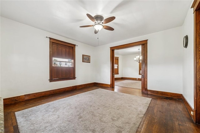 520 Morrell Ave, Connellsville, PA 15425 - unfurnished room featuring dark wood-style floors, a ceiling fan, and a chandelier