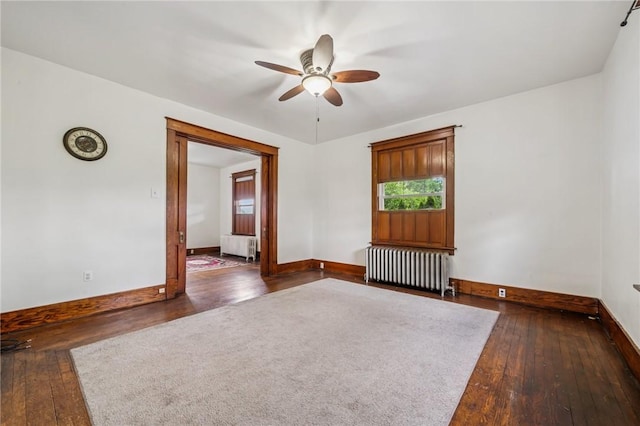 520 Morrell Ave, Connellsville, PA 15425 - spare room featuring radiator, wood-type flooring, and a ceiling fan