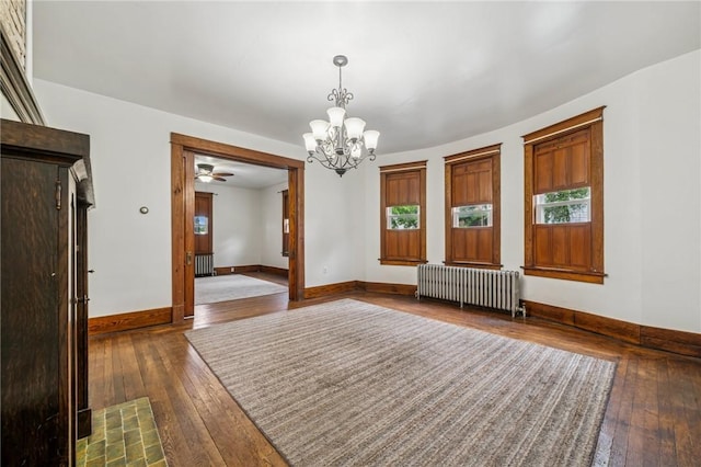 520 Morrell Ave, Connellsville, PA 15425 - spare room with radiator, dark wood-type flooring, a chandelier, and healthy amount of natural light