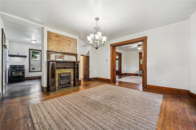 520 Morrell Ave, Connellsville, PA 15425 - unfurnished living room featuring dark wood-type flooring, a chandelier, a fireplace, and ceiling fan