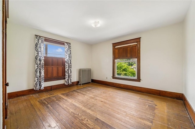 520 Morrell Ave, Connellsville, PA 15425 - unfurnished room with radiator heating unit and hardwood / wood-style flooring