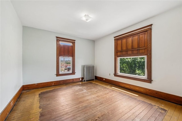 520 Morrell Ave, Connellsville, PA 15425 - spare room featuring radiator heating unit and hardwood / wood-style flooring