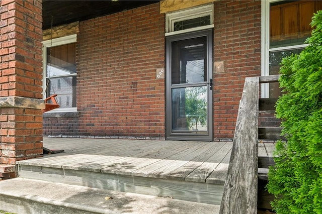 520 Morrell Ave, Connellsville, PA 15425 - view of exterior entry featuring brick siding and covered porch
