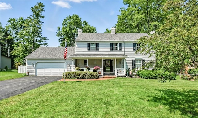 4735 Pine Cone Dr, Hermitage, PA 16148 - view of front of home with a porch, an attached garage, driveway, a front lawn, and a chimney