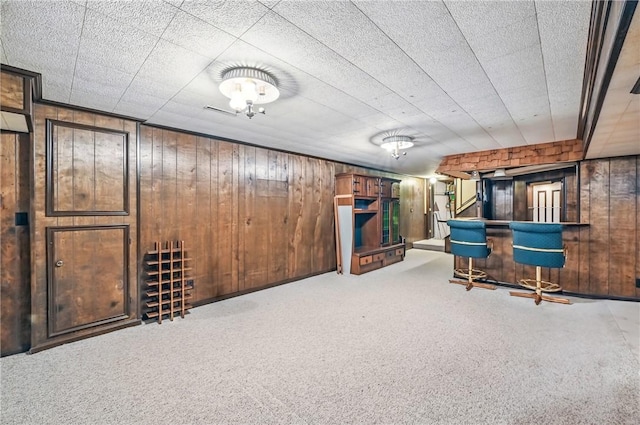 4735 Pine Cone Dr, Hermitage, PA 16148 - finished basement featuring wood walls, carpet floors, and stairway
