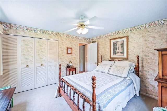 4735 Pine Cone Dr, Hermitage, PA 16148 - carpeted bedroom with wallpapered walls, a closet, and a ceiling fan