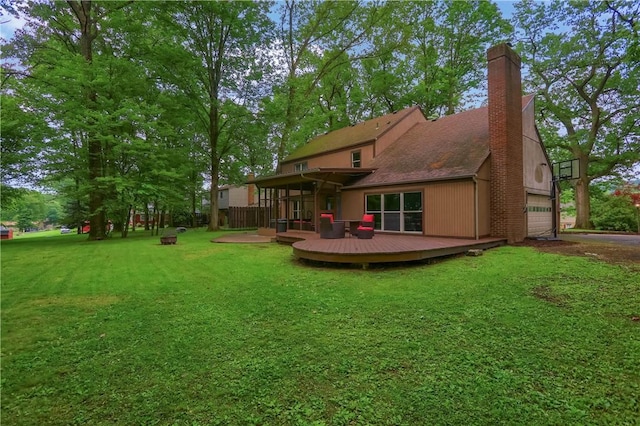 1259 Lakevue Dr, Penn Twp, PA 16001 - rear view of house featuring a deck, a lawn, a chimney, and an attached garage