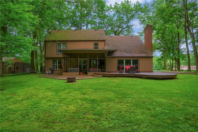 1259 Lakevue Dr, Penn Twp, PA 16001 - rear view of house with an outdoor fire pit, a sunroom, a deck, and a chimney