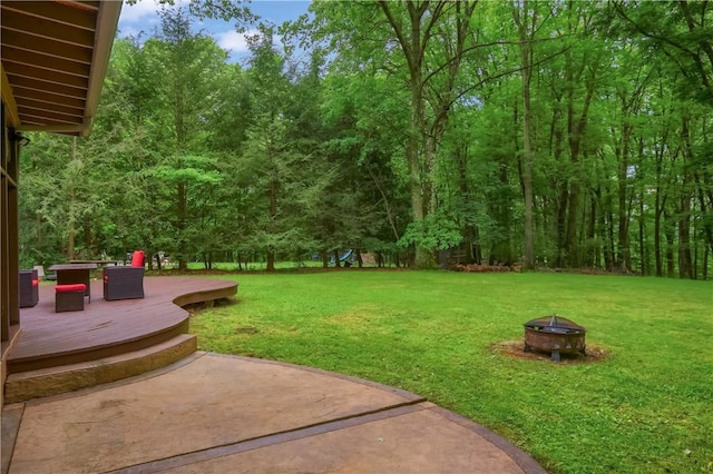 1259 Lakevue Dr, Penn Twp, PA 16001 - view of grassy yard with an outdoor fire pit, a playground, a deck, and a patio area