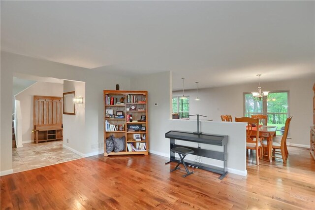 1259 Lakevue Dr, Penn Twp, PA 16001 - sitting room with light wood finished floors and a chandelier