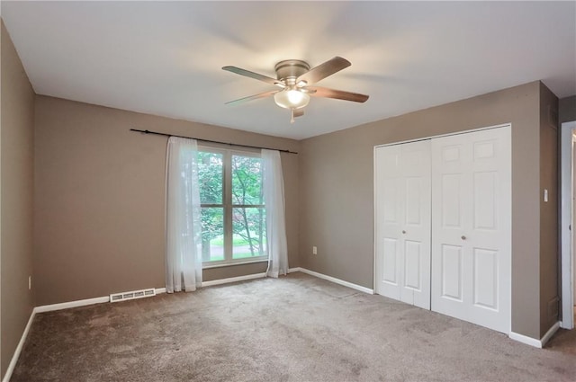 1259 Lakevue Dr, Penn Twp, PA 16001 - unfurnished bedroom featuring carpet floors, a closet, and a ceiling fan