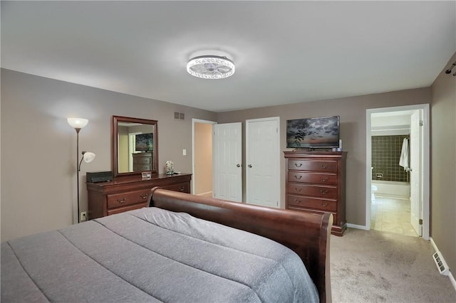 1259 Lakevue Dr, Penn Twp, PA 16001 - bedroom with light colored carpet and connected bathroom