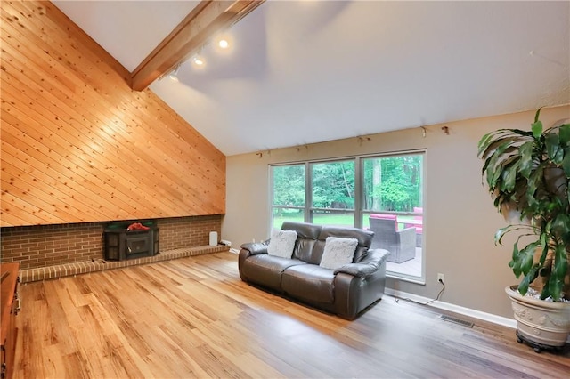 1259 Lakevue Dr, Penn Twp, PA 16001 - living area with an accent wall, brick wall, wood finished floors, beamed ceiling, and high vaulted ceiling