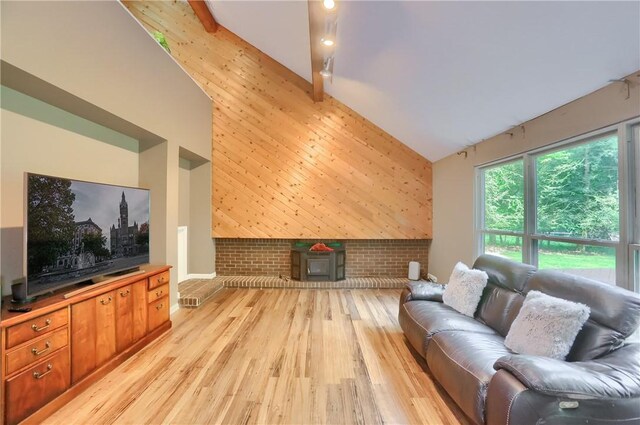 1259 Lakevue Dr, Penn Twp, PA 16001 - living room with high vaulted ceiling, light wood-type flooring, an accent wall, and brick wall