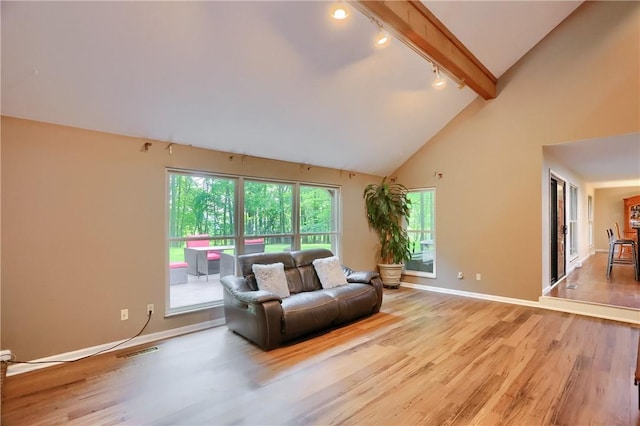 1259 Lakevue Dr, Penn Twp, PA 16001 - living area with rail lighting, light wood-style flooring, beamed ceiling, and high vaulted ceiling