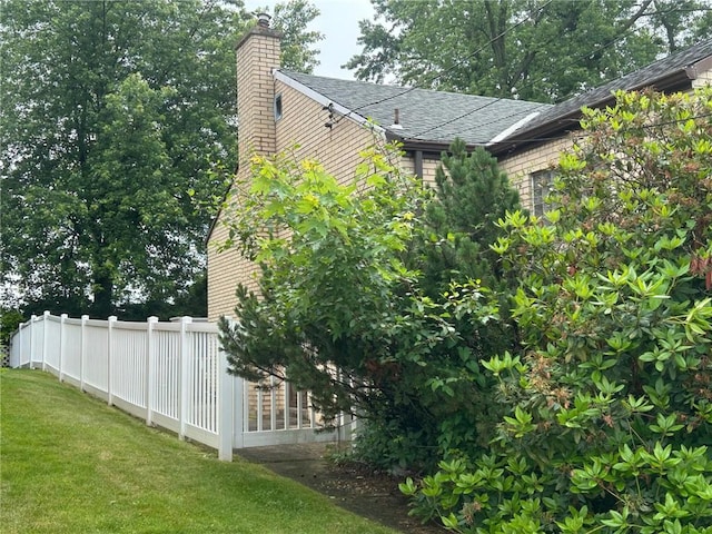 1006 Grandview Ave, Ross Twp, PA 15237 - view of side of home featuring a chimney and roof with shingles